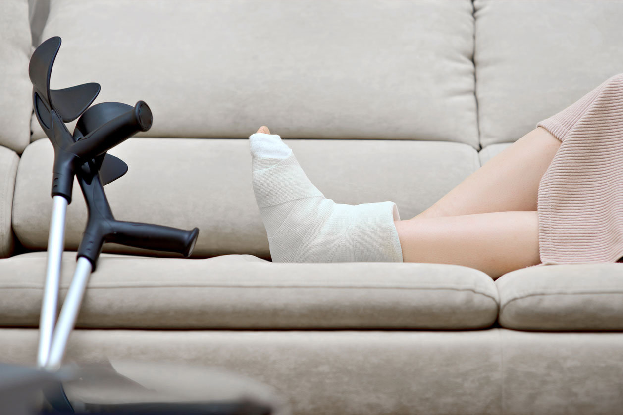 A patient using crutches due to an ankle injury