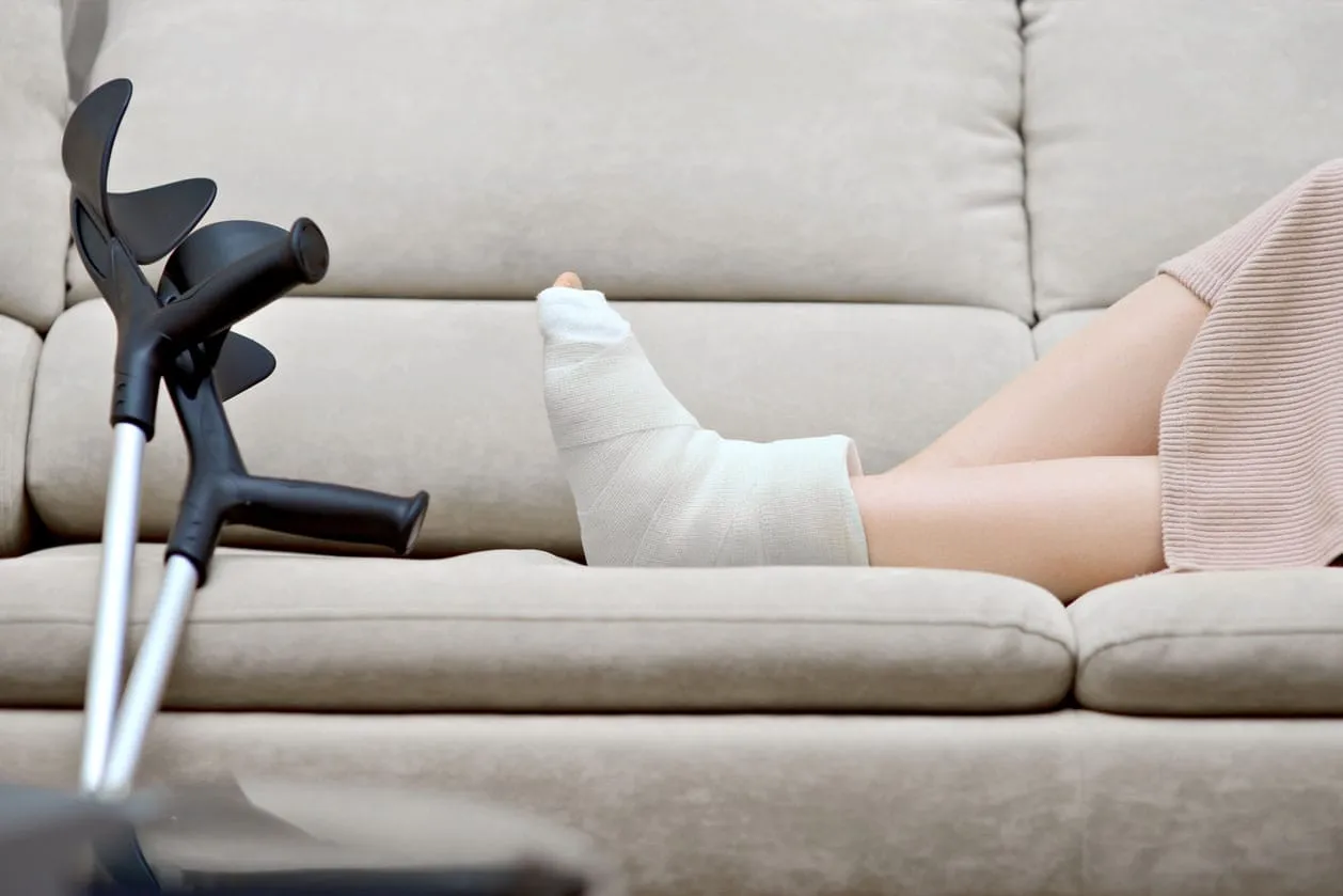 A patient using crutches due to an ankle injury