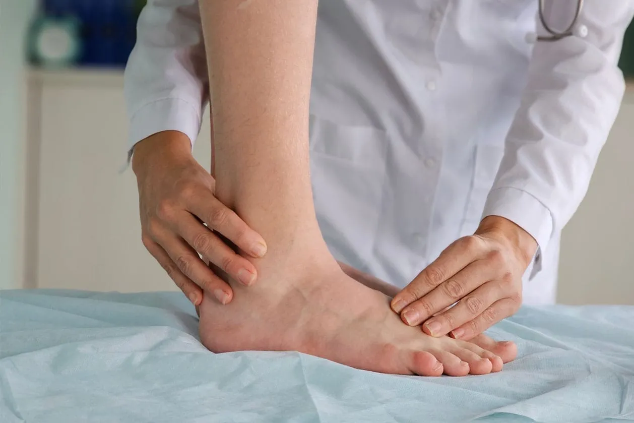 An ankle being examined at a clinic